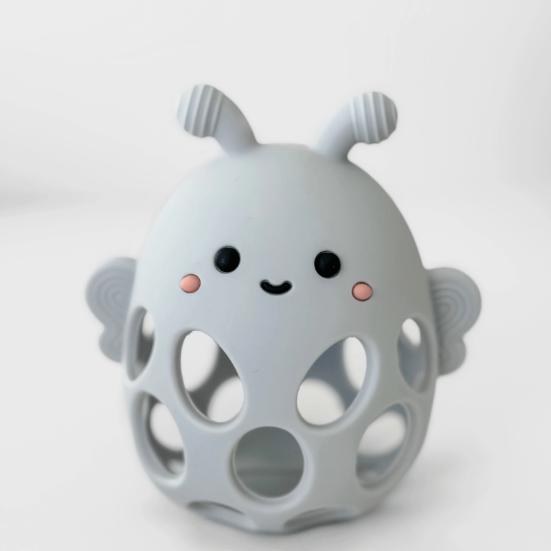 Gray teether toy with a cute face design on a white background