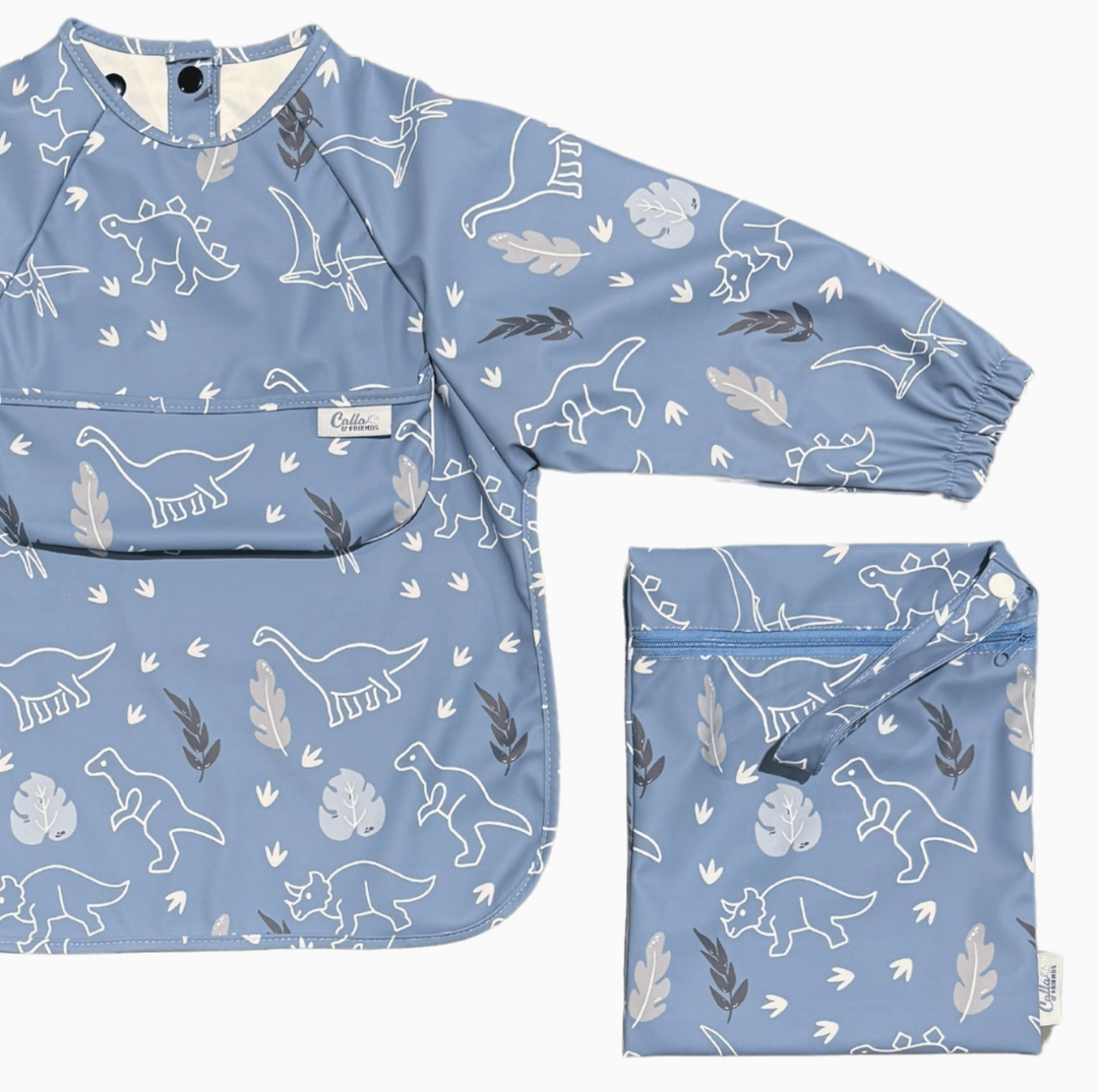 blue long sleeved bib with dinosaur pattern