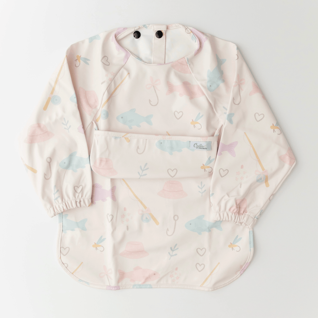 light pink long sleeved bib with fish and fishing gear pattern