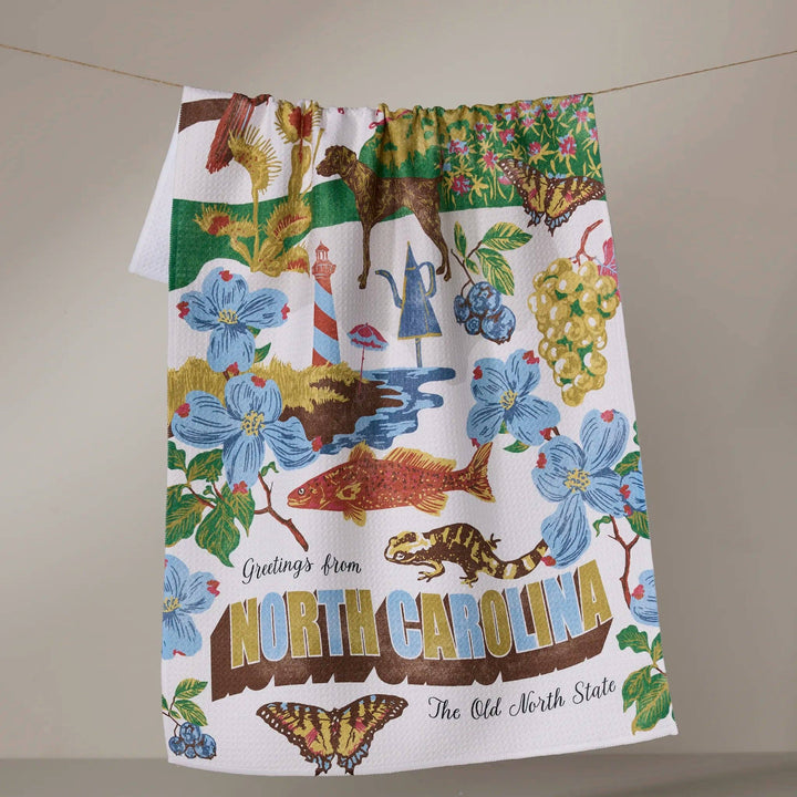 Decorative towel with North Carolina-themed design on a neutral background
