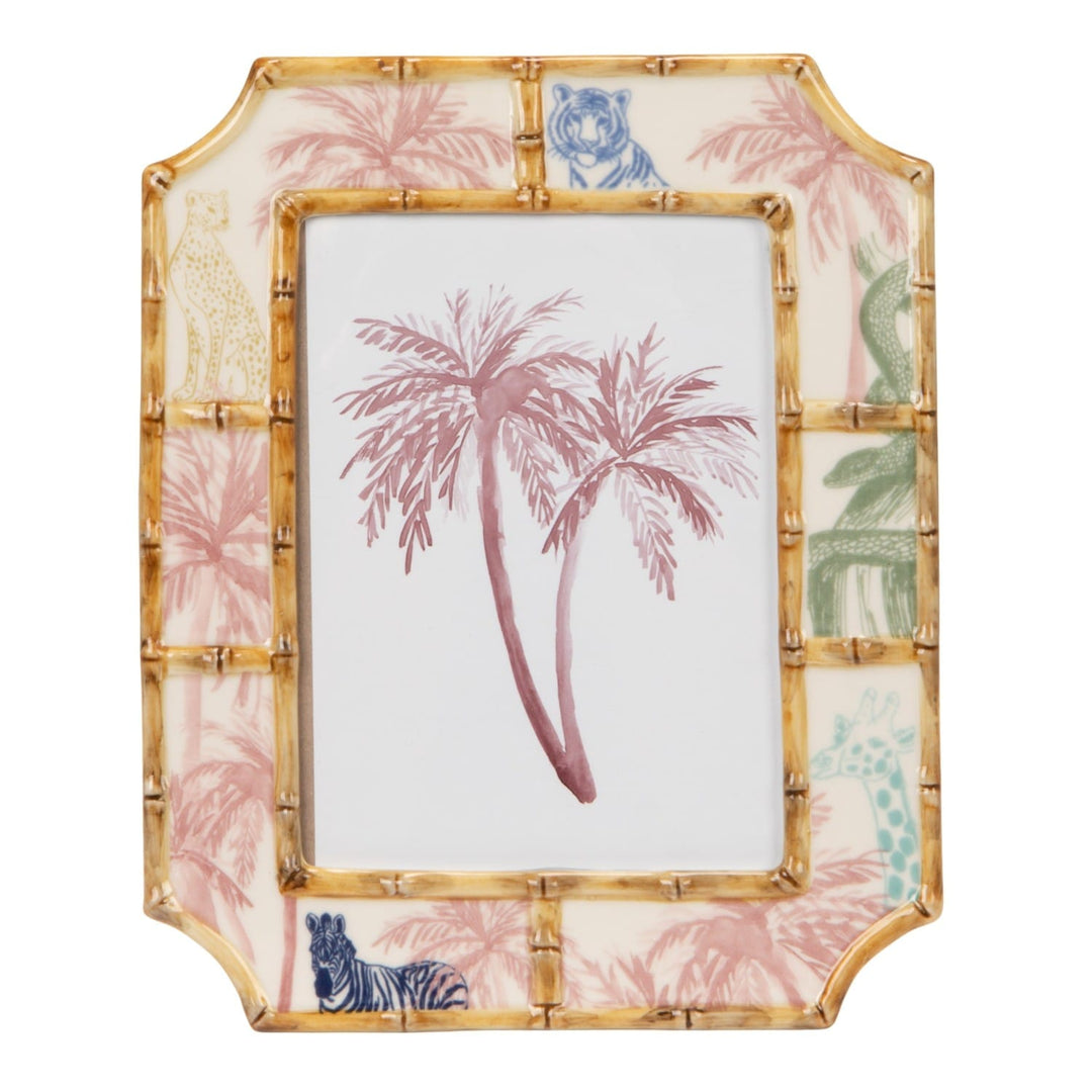 Decorative photo frame with palm tree design on a white background