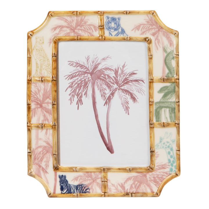 Decorative photo frame with palm tree design on a white background