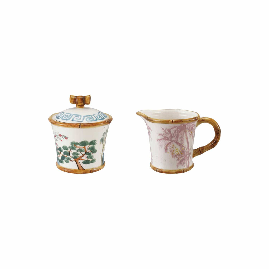 Two ceramic containers with floral designs on a white background