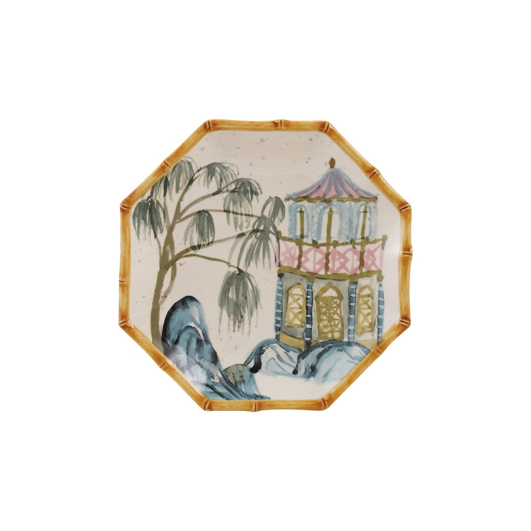 An octagonal ceramic plate featuring a hand-painted Chinese landscape scene with a pagoda, willow tree, rocks, and blue cranes on a white background.