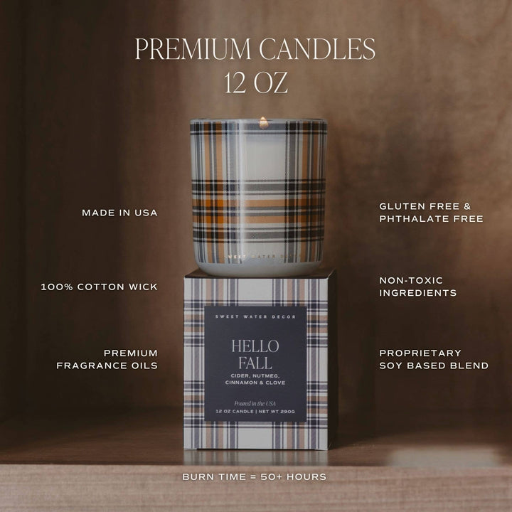 A 12 oz scented candle in a plaid-patterned glass jar sits on top of its matching box. The background is a warm brown textured backdrop with white text highlighting product features such as 'PREMIUM CANDLES 12 OZ', 'MADE IN USA', '100% COTTON WICK', and others.