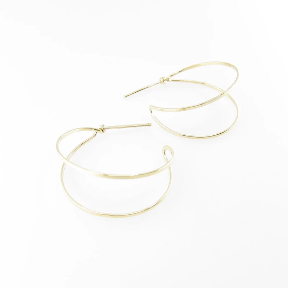 Juli Mills 14K gold filled forged post double hoop earrings on white background.