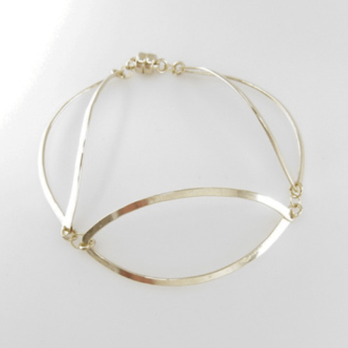 Bracelet with 3 forged 14K gold filled curved marquis links with magnetic clasp on white background.