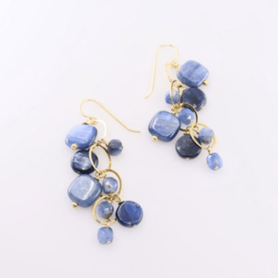 Blue beaded earrings with gold accents on a white background