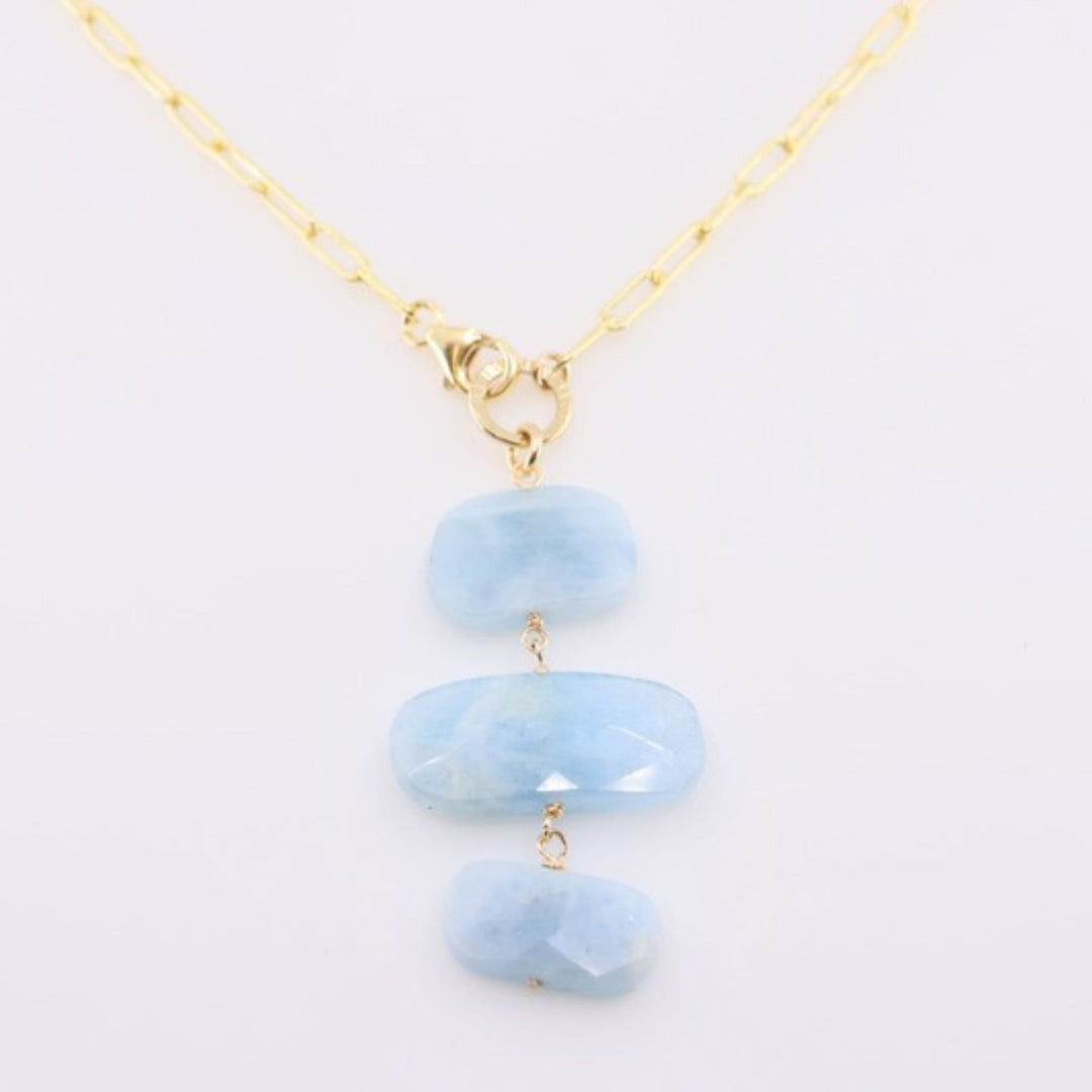 Necklace with light blue stones on a white background