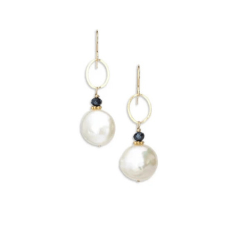 Pair of pearl earrings with gold and silver loops on a white background
