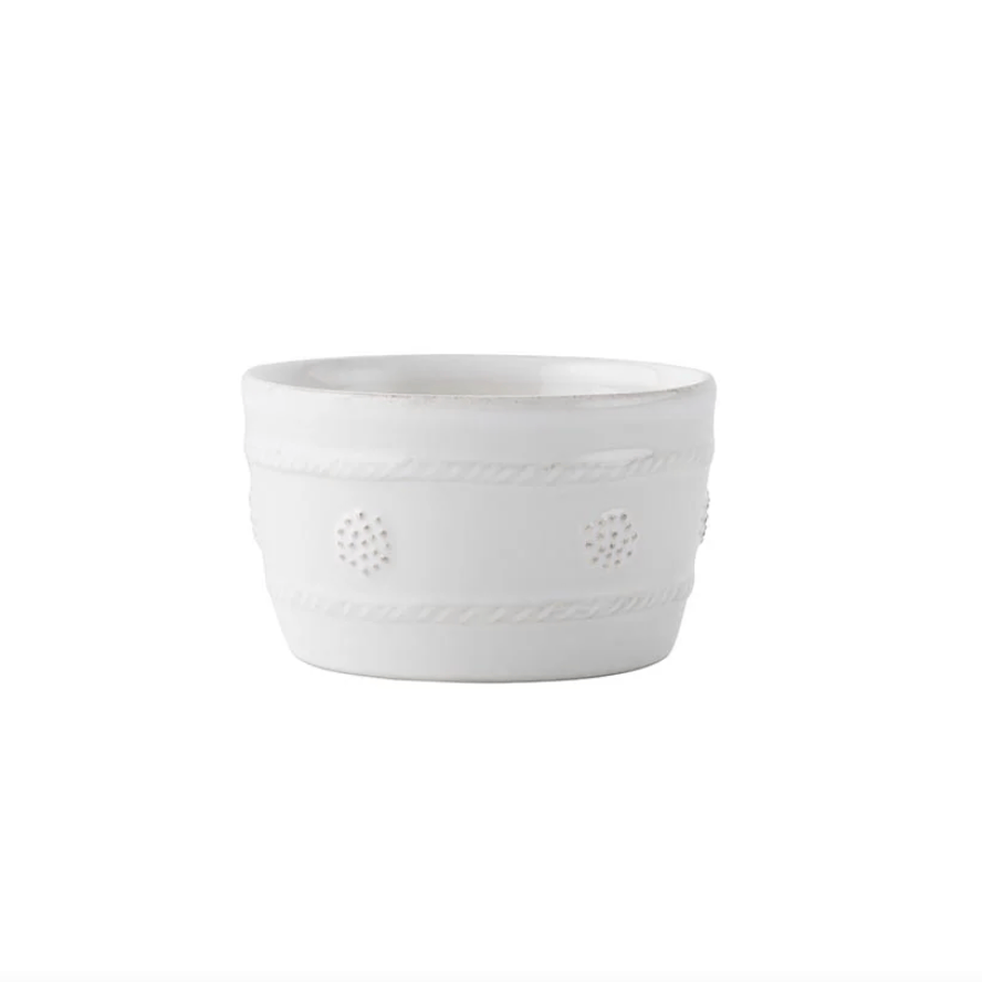 white ceramic ramekin with small raised details along side 