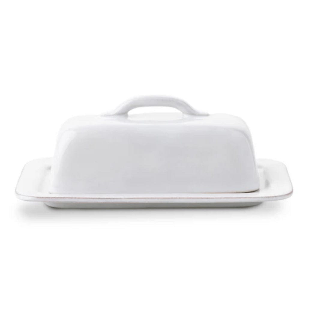 White ceramic butter dish with lid on a white background