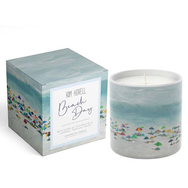 Candle and packaging with 'Beach Day' design on a light gray background