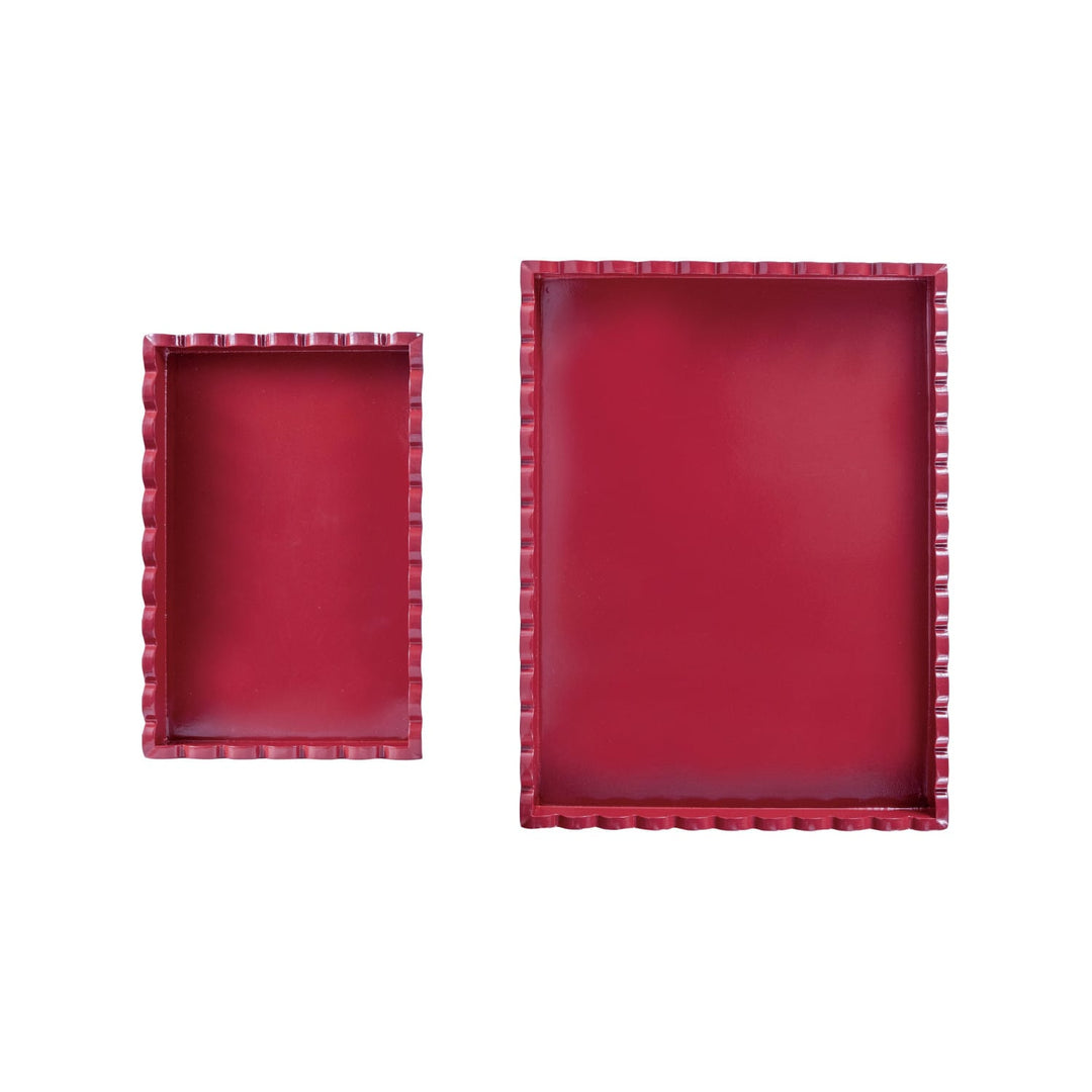 Two red rectangular trays with decorative edges on a white background