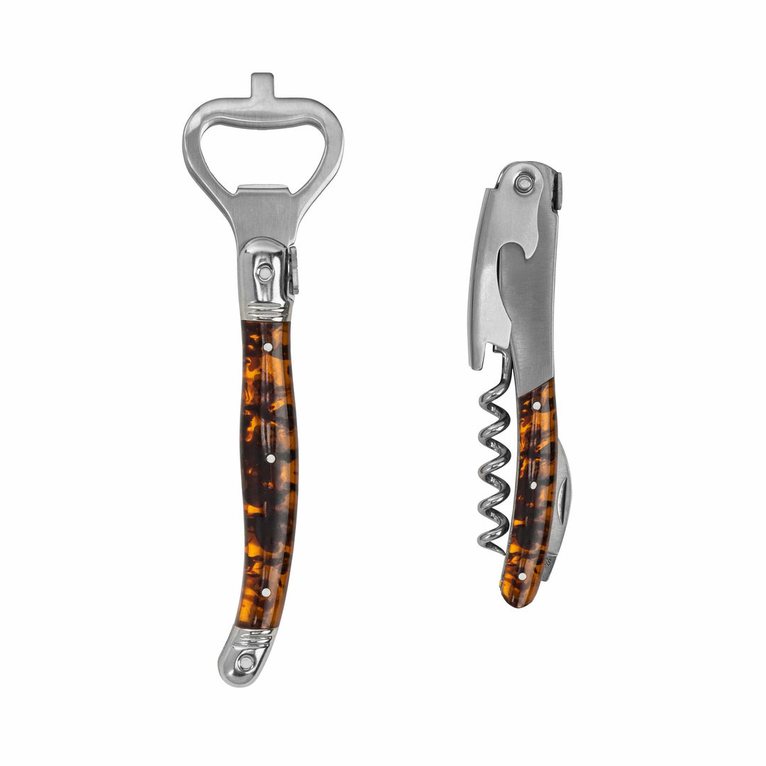Two bottle openers with tortoiseshell handles on a white background
