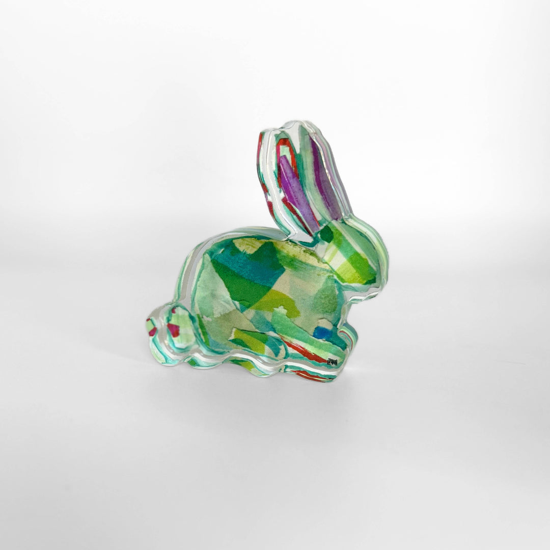 Colorful glass rabbit figurine on a white background