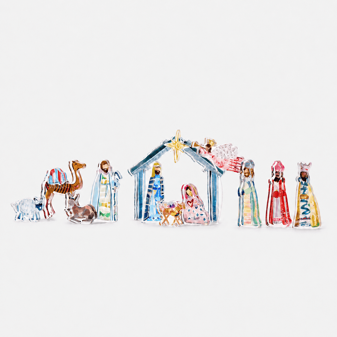 Colorful nativity scene figures on a white background Lauren Dunn