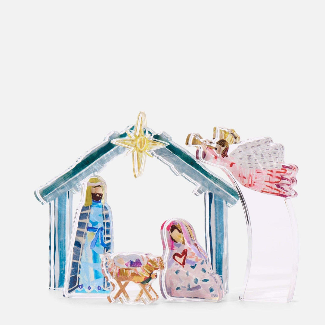 Decorative nativity scene with Mary, Joseph, and baby Jesus in a manger on a white background.