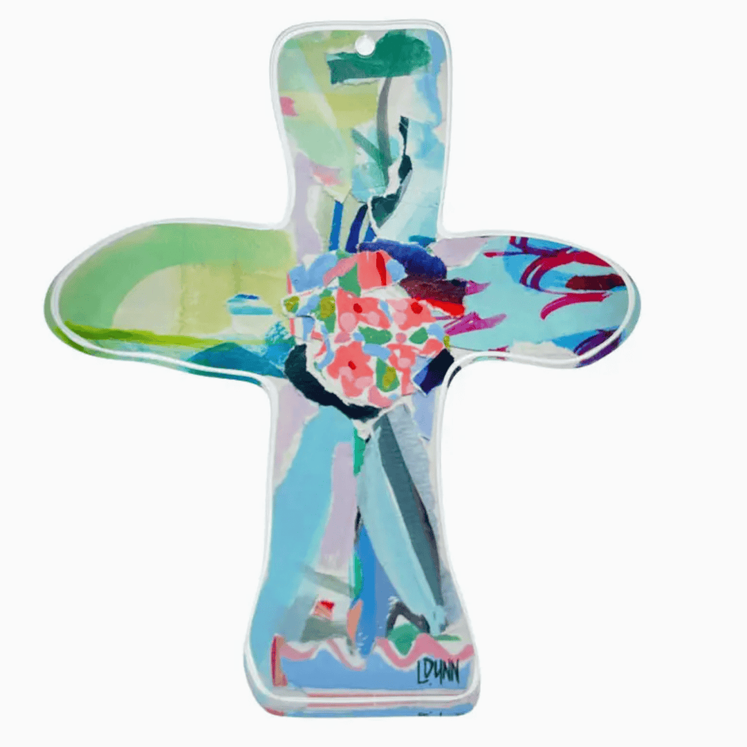 Colorful cross-shaped object with artistic design on a white background