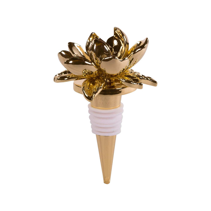 Gold magnolia flower bottle stopper on a white background