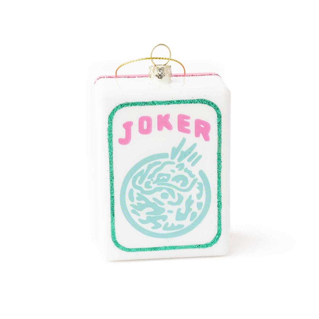 Card-shaped ornament with 'Joker' text and decorative design on a white background