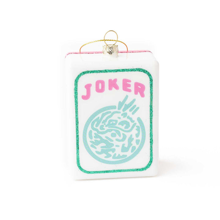 Card-shaped ornament with 'Joker' text and decorative design on a white background
