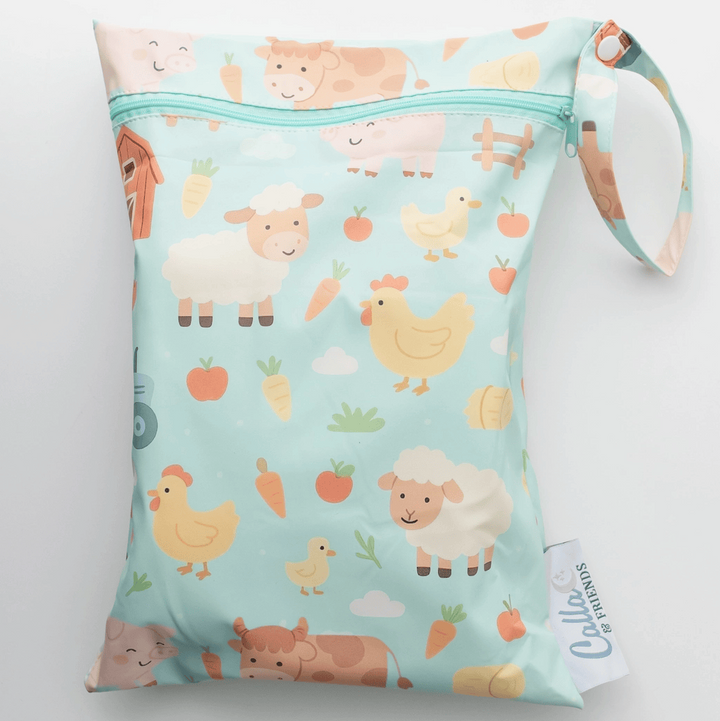 Wet bag with farm animal pattern on a light blue background