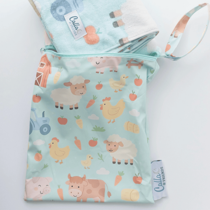 Two fabric bags with farm animal patterns on a white background