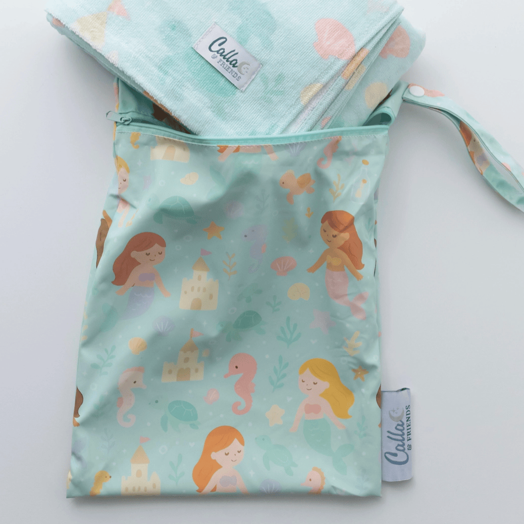 Mermaid-patterned fabric bag with matching headband on a light gray background