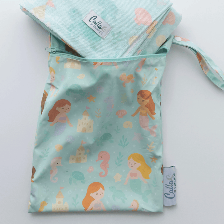 Mermaid-patterned fabric bag with matching headband on a light gray background
