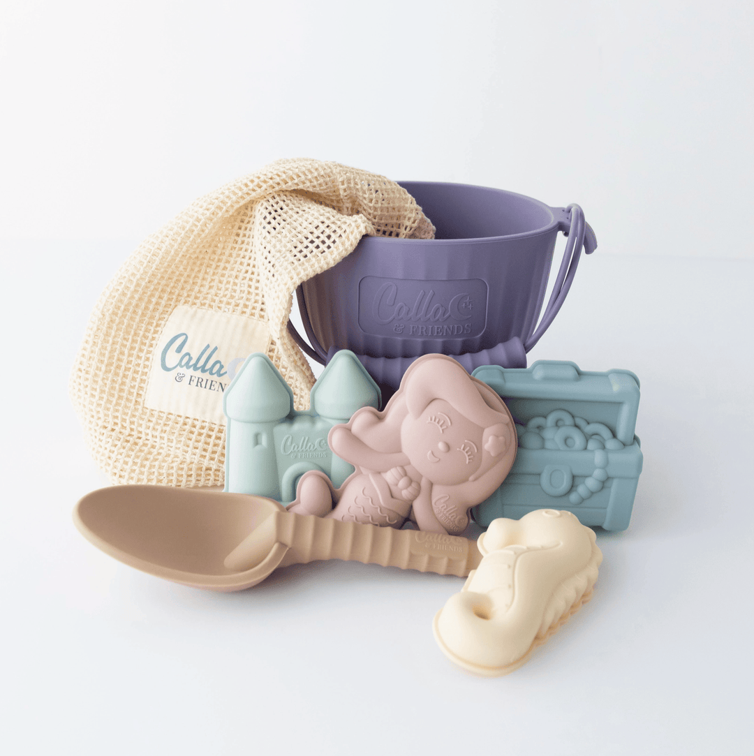 Set of baby toys including a spoon, castle, and animal-shaped molds on a white background.
