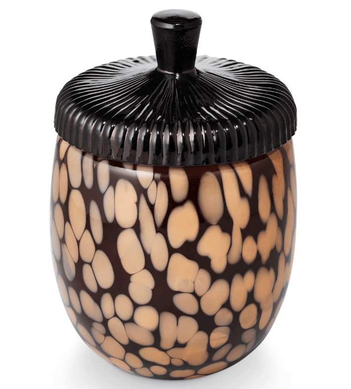 A decorative lidded jar with a glossy black ribbed lid and a rounded body covered in an organic beige and dark brown spotted pattern, shown on a white background.