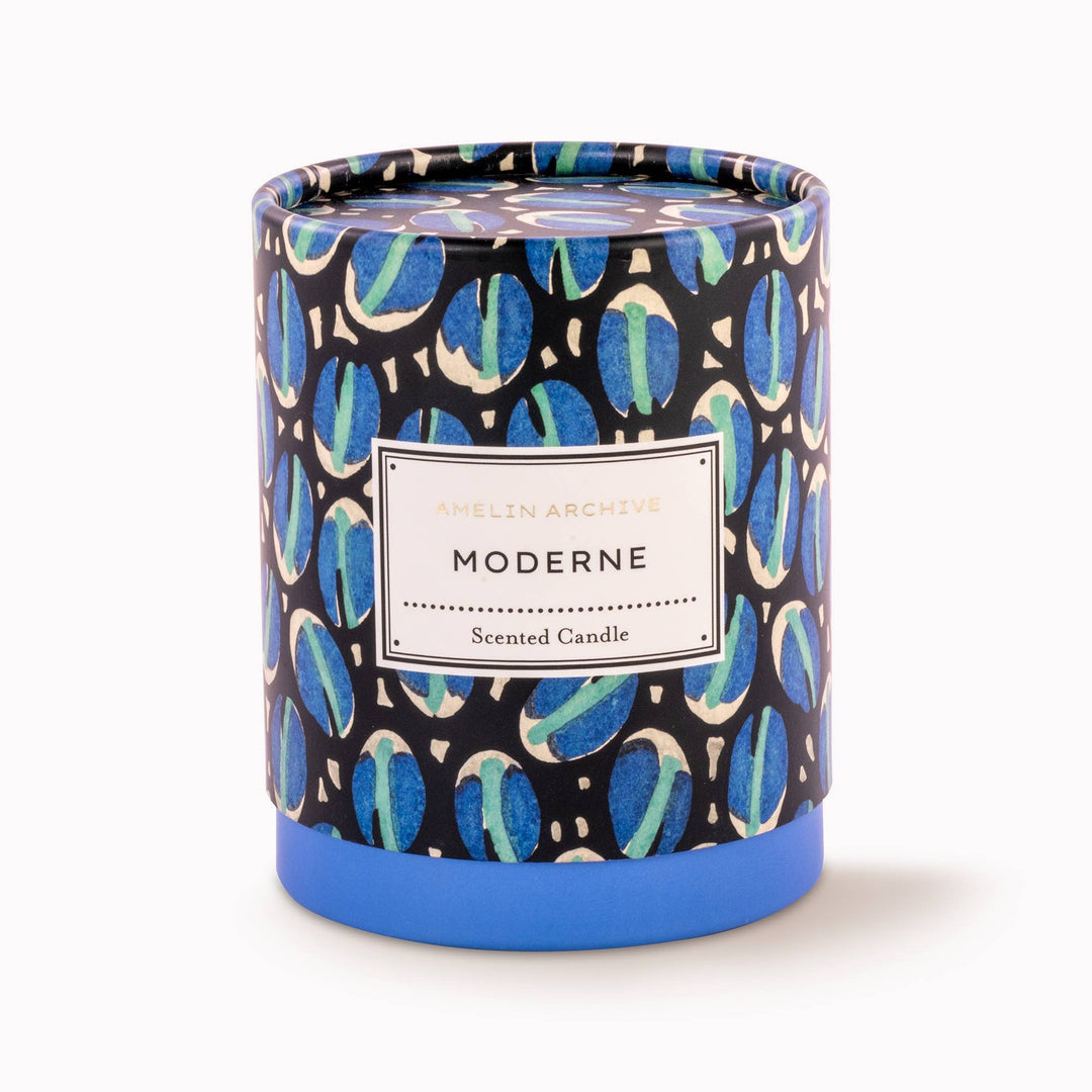 Scented candle with a patterned lid on a white background