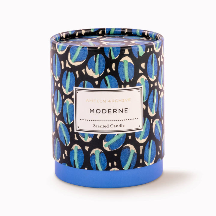Scented candle with a patterned lid on a white background