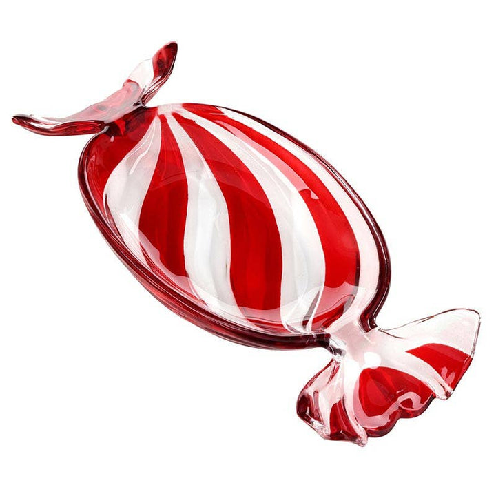 A decorative glass candy dish shaped like a wrapped candy, featuring bold red and white vertical stripes, shown on a solid white background.
