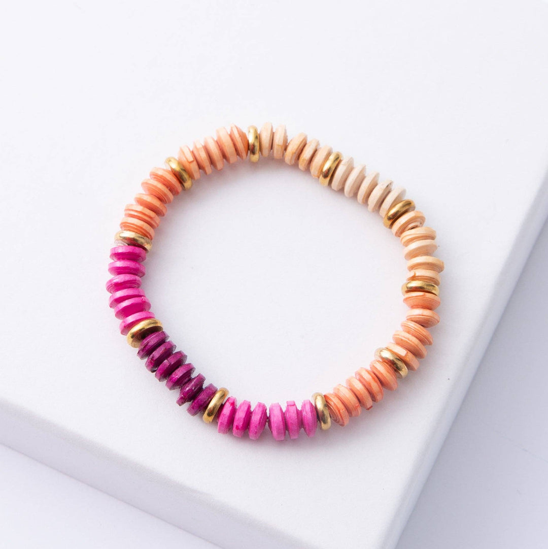 Colorful beaded bracelet on a white surface