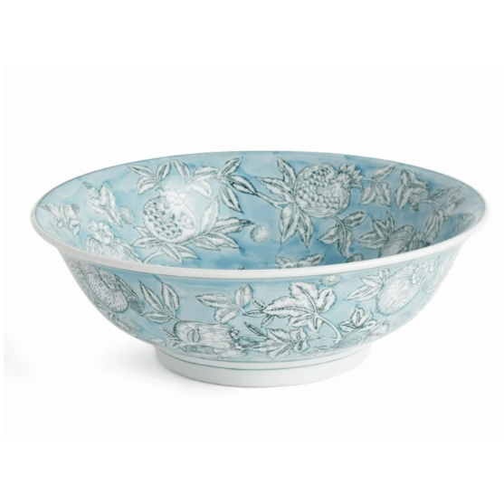 Decorative bowl with floral pattern on a light blue background