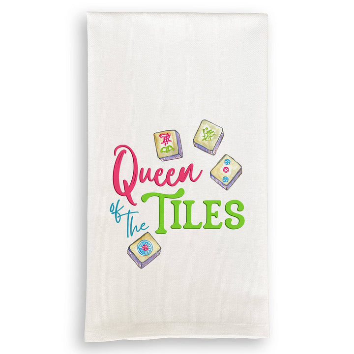 White towel with 'Queen of the Tiles' text and tile graphics on a white background