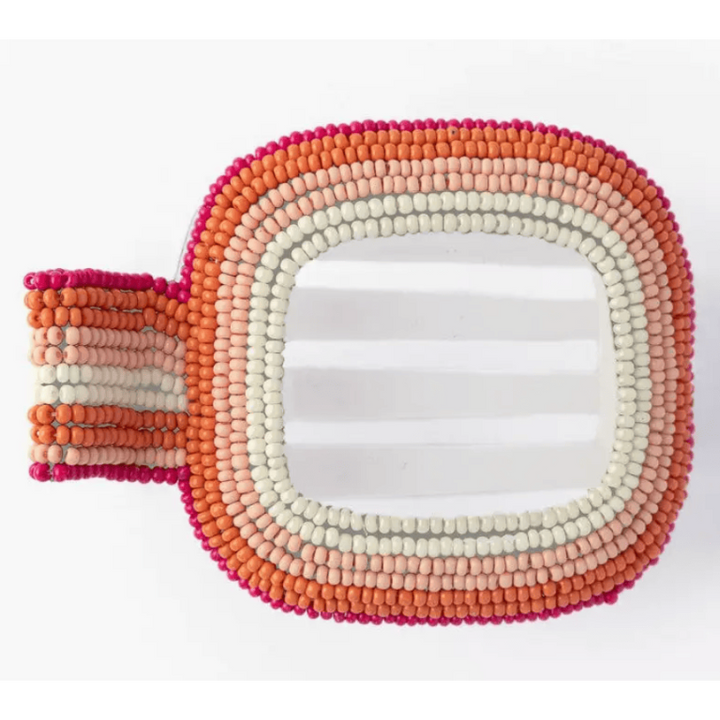Beaded hair clip in pink, orange, and white on a white background