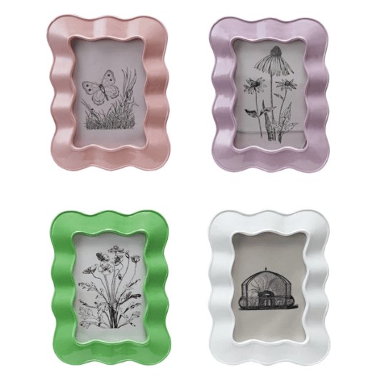 Set of four decorative picture frames in pink, purple, green, and silver on a white background.