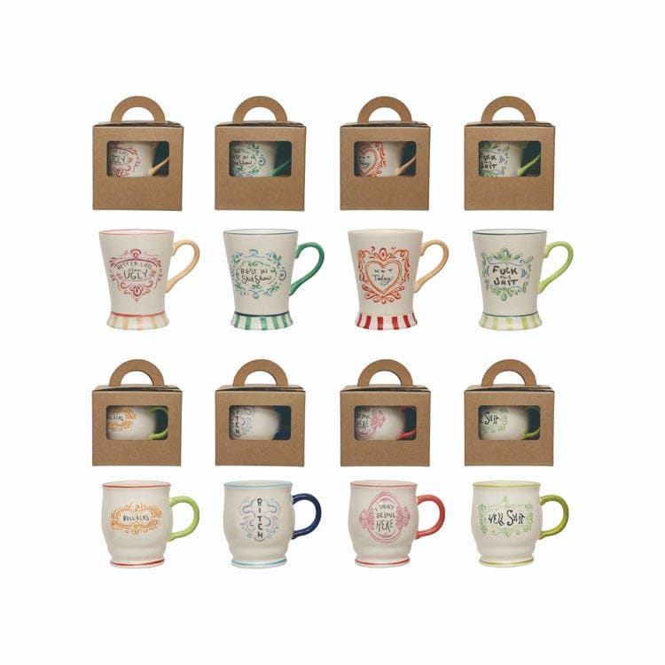Set of ceramic mugs with various designs in gift boxes on a white background
