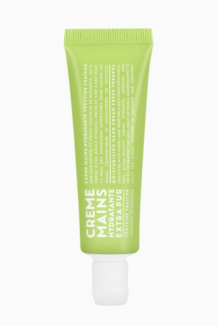 Green tube of hand cream with text on a white background