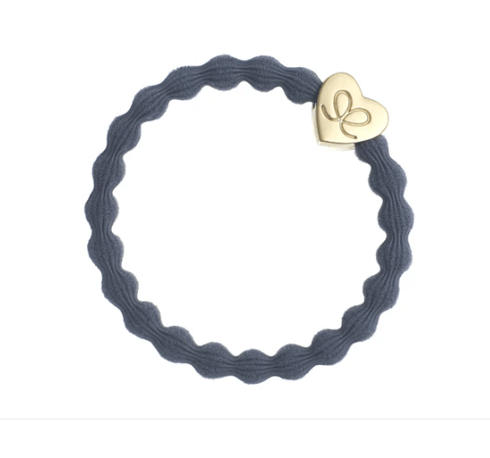 Navy blue hair tie with a gold heart-shaped charm on a white background