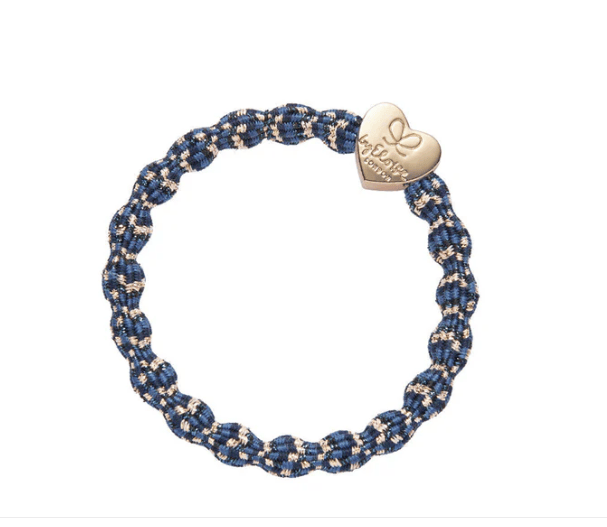 Blue and gold braided bracelet with a heart-shaped tag on a white background