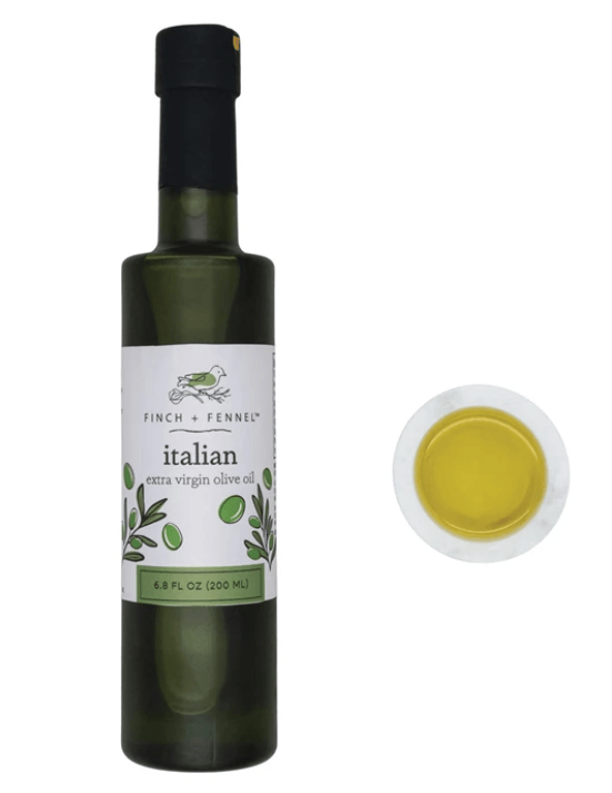 Bottle of Italian extra virgin olive oil with a close-up of the oil on a white background