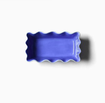 Iris blue ceramic loaf pan on white background. 