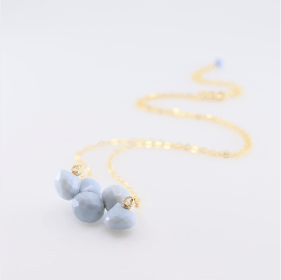 African blue opal mini gemstone cluster on 14K gold filled chain on white background.