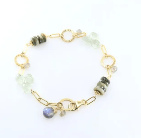 Bracelet with gold chain and multicolored beads on a white background