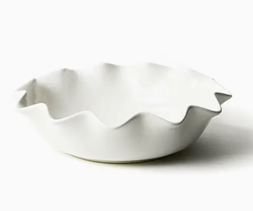 White ceramic entree bowl with ruffled edge on a white background