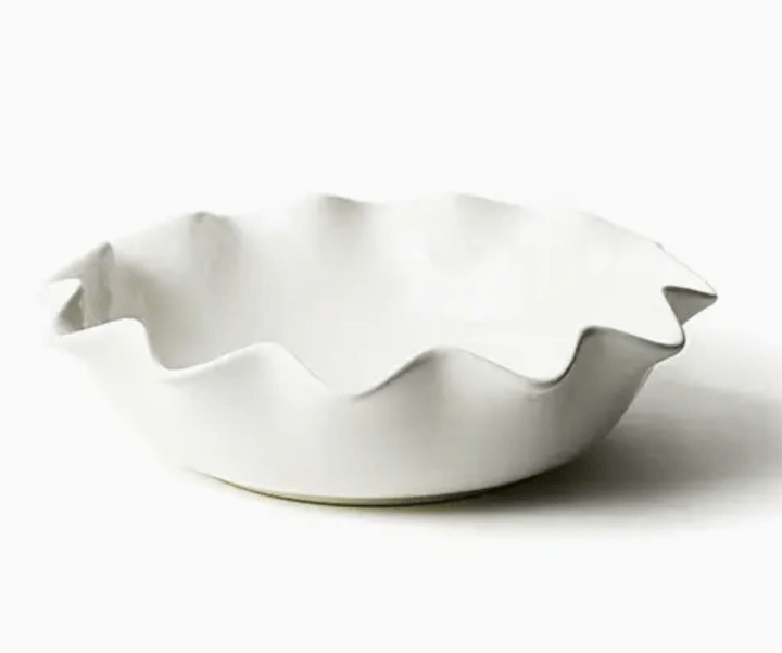 White ceramic entree bowl with ruffled edge on a white background